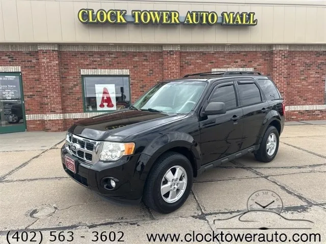 
                           2010 Ford Escape  Escape in front of Clock Tower Mall Used car business
                       