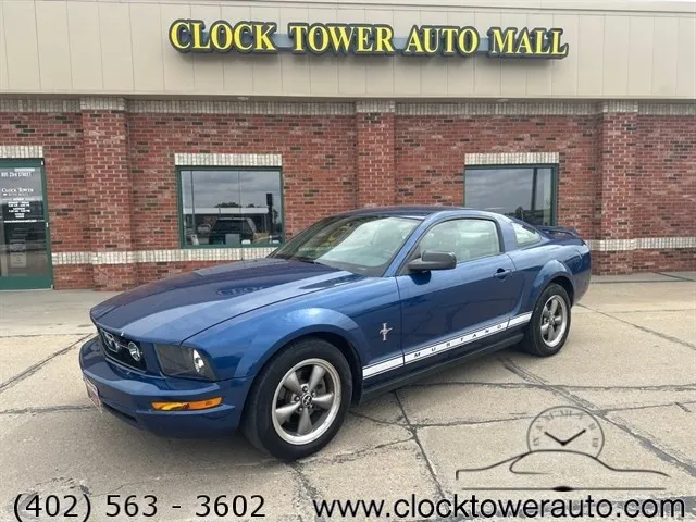
                           2006 Ford Mustang  Mustang in front of Clock Tower Mall Used car business
                       